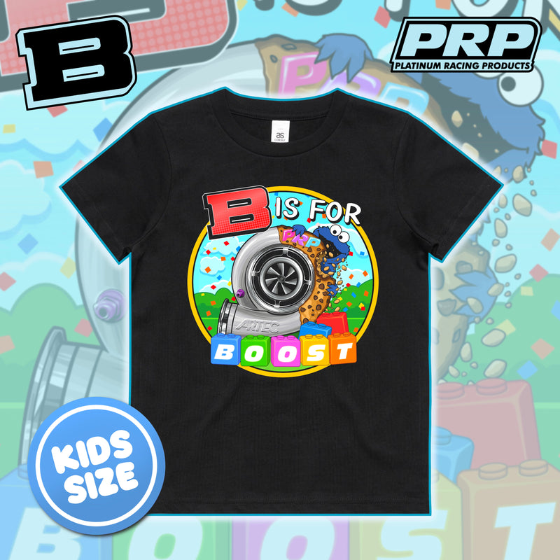 A black kids' short-sleeve T-shirt with a colorful turbocharger and 'B IS FOR BOOST' graphic, shown on a playful light blue background with PRP branding and a 'KIDS SIZE' badge.