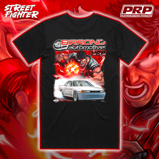 Black t-shirt with 'PRP' and 'Birrong Automotive' graphic design on a red and orange abstract background.