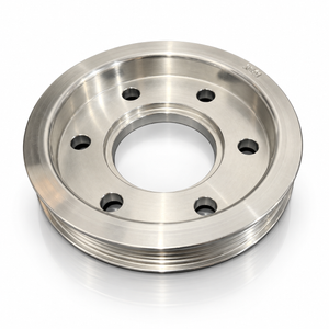 A polished steel automotive pulley with a ribbed outer belt groove, six bolt holes, and a machined center hub, shown on a white background with a soft reflection.